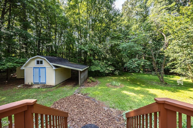 3104 Braywood Ct, Apex, NC 27539 - view of grassy yard with a storage unit and a carport