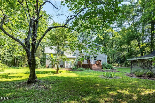 3104 Braywood Ct, Apex, NC 27539 - view of grassy yard featuring a wooden deck