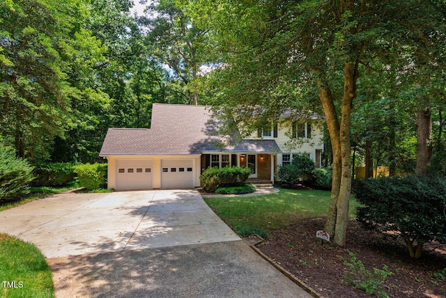2330 Thunder Rd, Durham, NC 27712 - view of front of home with concrete driveway, a garage, roof with shingles, and a front lawn