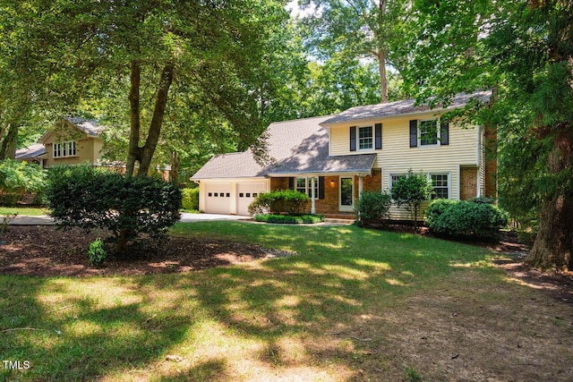 2330 Thunder Rd, Durham, NC 27712 - view of front of property with an attached garage, a front lawn, driveway, and brick siding