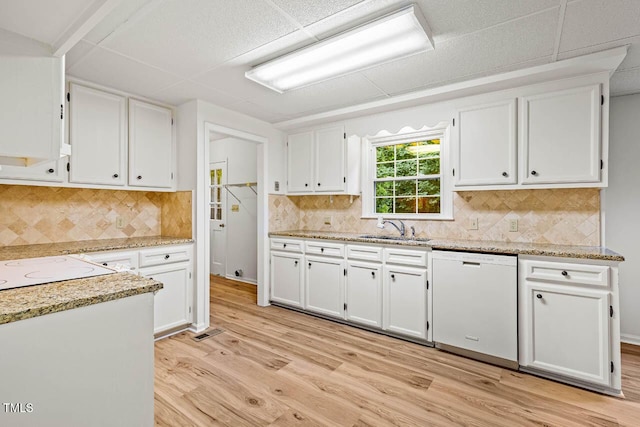 2330 Thunder Rd, Durham, NC 27712 - kitchen with white appliances, white cabinets, light wood finished floors, and backsplash