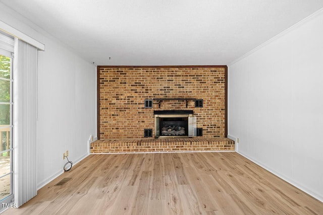 2330 Thunder Rd, Durham, NC 27712 - unfurnished living room featuring light wood-style floors, crown molding, and a fireplace