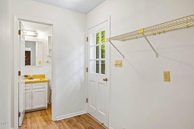 2330 Thunder Rd, Durham, NC 27712 - laundry room featuring a sink and light wood-type flooring