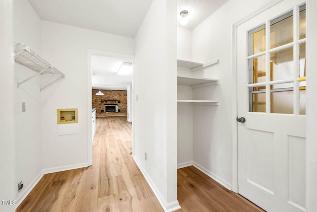 2330 Thunder Rd, Durham, NC 27712 - washroom with hookup for a washing machine and light wood finished floors