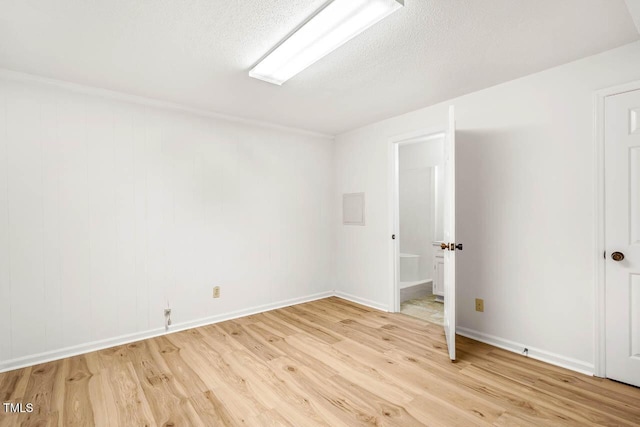 2330 Thunder Rd, Durham, NC 27712 - empty room with light wood-type flooring and a textured ceiling
