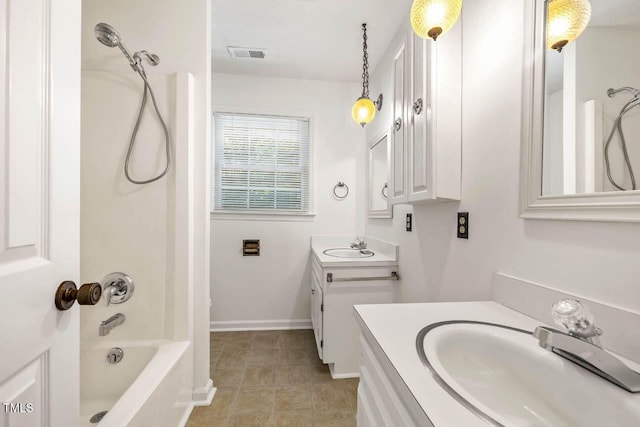 2330 Thunder Rd, Durham, NC 27712 - bathroom featuring two vanities, washtub / shower combination, and tile patterned flooring