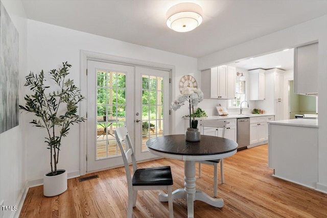 6311 Brandywine Rd, Raleigh, NC 27607 - dining room with light wood-type flooring and french doors