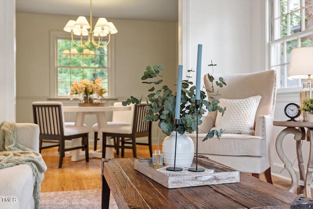6311 Brandywine Rd, Raleigh, NC 27607 - living room featuring a chandelier and wood finished floors