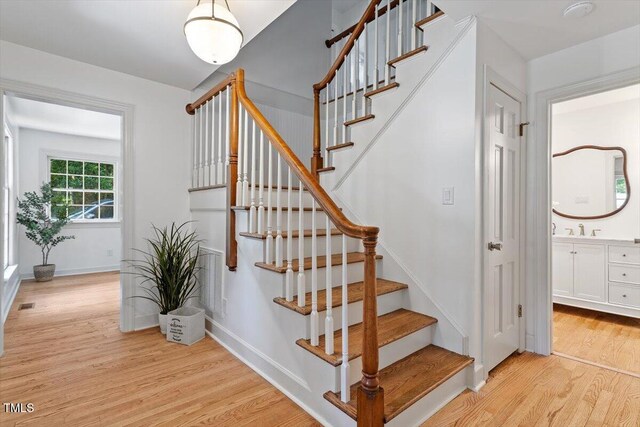 6311 Brandywine Rd, Raleigh, NC 27607 - stairway with wood finished floors and baseboards