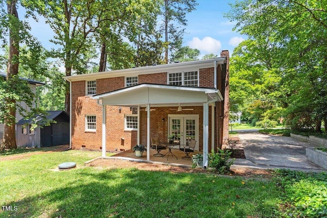 6311 Brandywine Rd, Raleigh, NC 27607 - rear view of property with a chimney, a lawn, ceiling fan, a patio, and brick siding