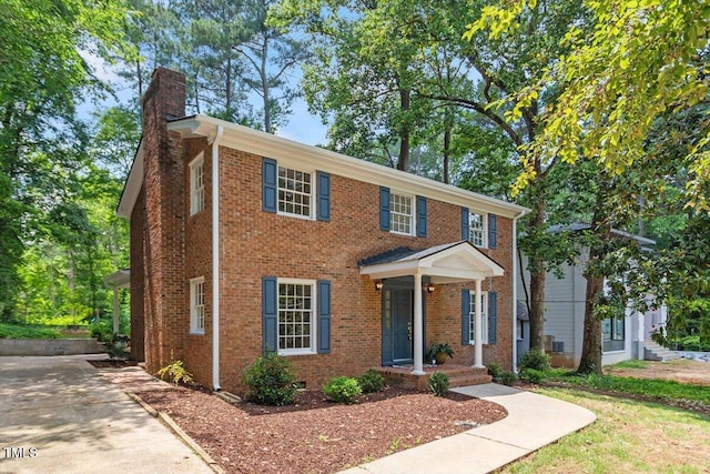6311 Brandywine Rd, Raleigh, NC 27607 - view of front of property with a chimney and brick siding