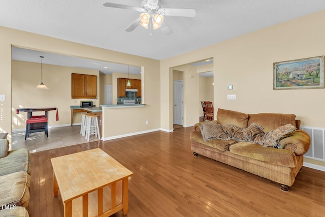 2114 Baycourt Trl, Hillsborough, NC 27278 - living area featuring ceiling fan and wood finished floors