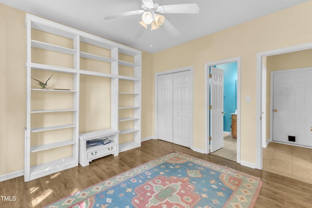 2114 Baycourt Trl, Hillsborough, NC 27278 - unfurnished bedroom with wood finished floors, a closet, and ceiling fan