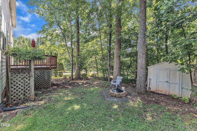 2114 Baycourt Trl, Hillsborough, NC 27278 - view of yard featuring a shed, a deck, and a fire pit