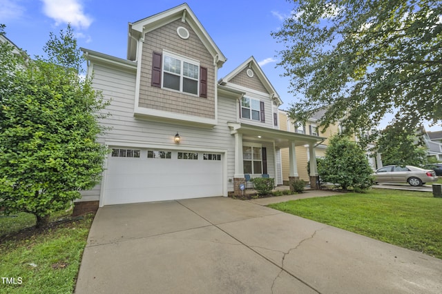 1204 Chapanoke Rd, Raleigh, NC 27603 - view of front of house with an attached garage, a front yard, driveway, and covered porch