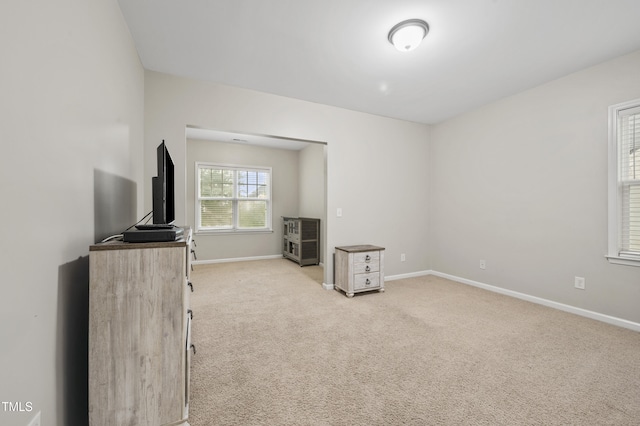 1204 Chapanoke Rd, Raleigh, NC 27603 - unfurnished living room featuring light colored carpet and baseboards