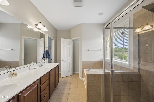 1204 Chapanoke Rd, Raleigh, NC 27603 - bathroom with a garden tub, a shower stall, double vanity, and tile patterned flooring