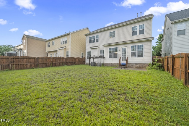 1204 Chapanoke Rd, Raleigh, NC 27603 - rear view of house with a fenced backyard and a patio