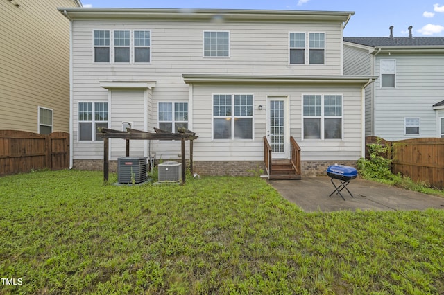 1204 Chapanoke Rd, Raleigh, NC 27603 - back of property with entry steps, a patio area, and a fenced backyard