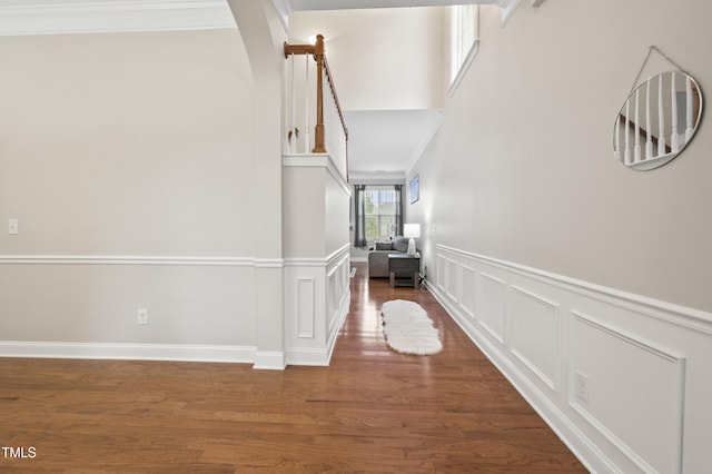1204 Chapanoke Rd, Raleigh, NC 27603 - hall with a decorative wall, a wainscoted wall, wood finished floors, and crown molding