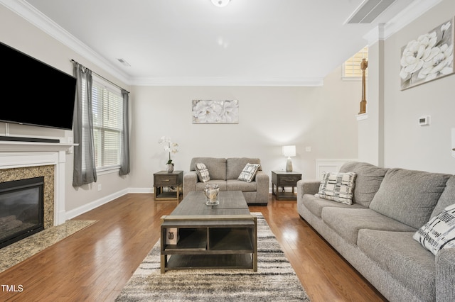 1204 Chapanoke Rd, Raleigh, NC 27603 - living area featuring crown molding, a fireplace, and wood finished floors