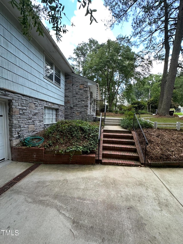 2022 Bivins St, Durham, NC 27707 - view of home's exterior with stone siding and stairs