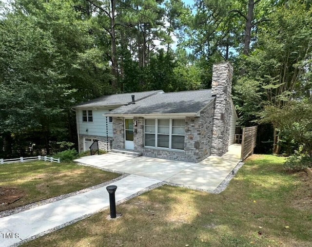 2022 Bivins St, Durham, NC 27707 - tri-level home featuring stone siding and a chimney