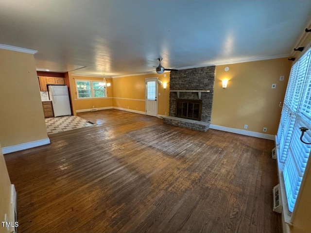 2022 Bivins St, Durham, NC 27707 - unfurnished living room with dark wood-type flooring, a fireplace, and crown molding
