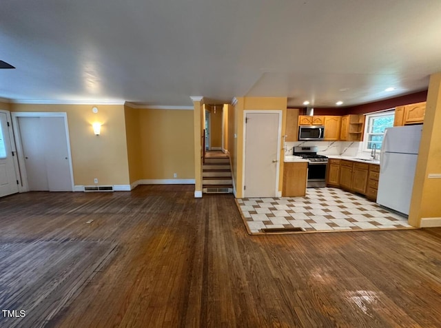 2022 Bivins St, Durham, NC 27707 - kitchen featuring appliances with stainless steel finishes, open floor plan, wood finished floors, open shelves, and light countertops