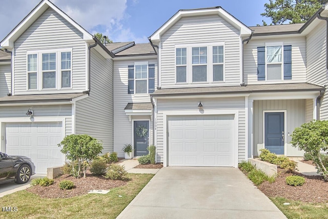 1004 Citadel Ave, Durham, NC 27713 - townhome / multi-family property with a garage and concrete driveway