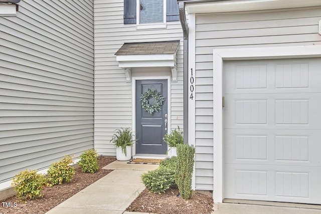 1004 Citadel Ave, Durham, NC 27713 - doorway to property featuring a garage