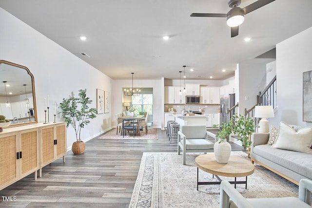 1004 Citadel Ave, Durham, NC 27713 - living area featuring light wood-type flooring, a ceiling fan, recessed lighting, and a chandelier