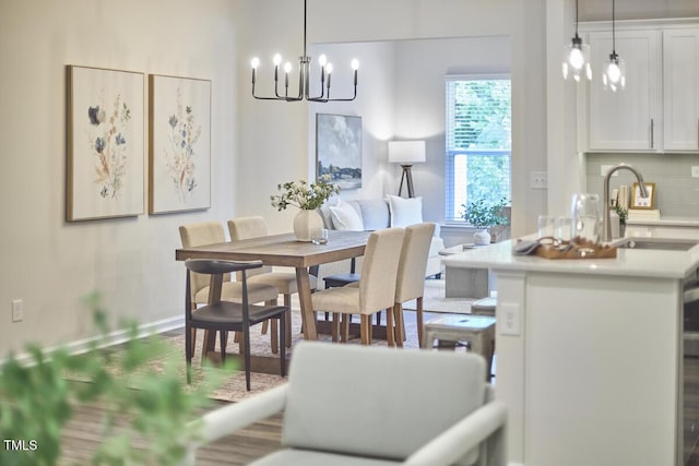 1004 Citadel Ave, Durham, NC 27713 - dining room with a chandelier and wood finished floors