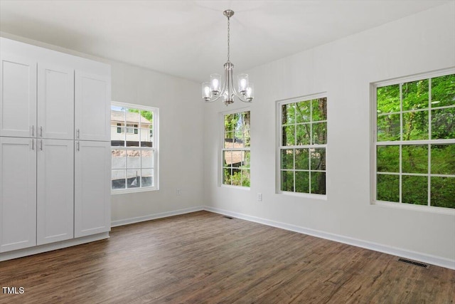 1408 S St, Durham, NC 27707 - unfurnished dining area with dark wood-type flooring and a chandelier