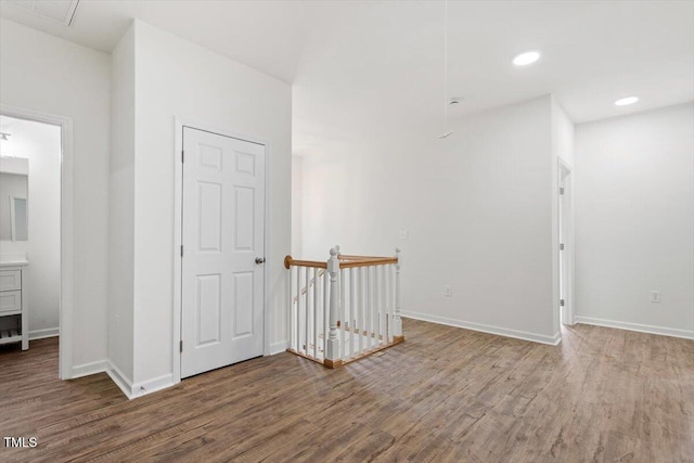 1408 S St, Durham, NC 27707 - corridor with an upstairs landing, wood finished floors, and recessed lighting