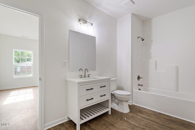 1408 S St, Durham, NC 27707 - full bath with vanity, wood finished floors, and washtub / shower combination