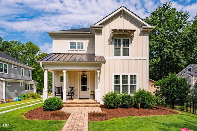 309 N Mason St, Apex, NC 27502 - modern farmhouse featuring board and batten siding, a porch, a standing seam roof, and a metal roof