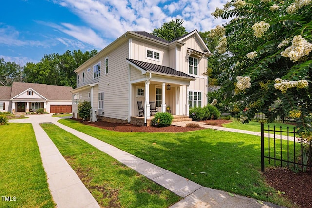 309 N Mason St, Apex, NC 27502 - modern inspired farmhouse featuring covered porch, a standing seam roof, board and batten siding, and a front yard