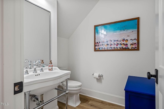 309 N Mason St, Apex, NC 27502 - half bathroom with wood finished floors and vaulted ceiling