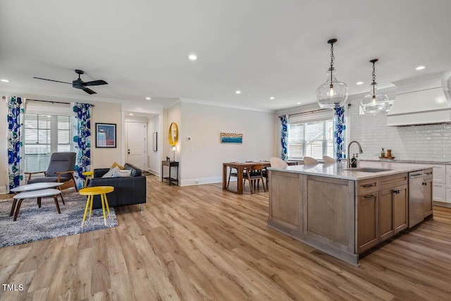 309 N Mason St, Apex, NC 27502 - kitchen with custom range hood, stainless steel dishwasher, recessed lighting, light wood-type flooring, and plenty of natural light