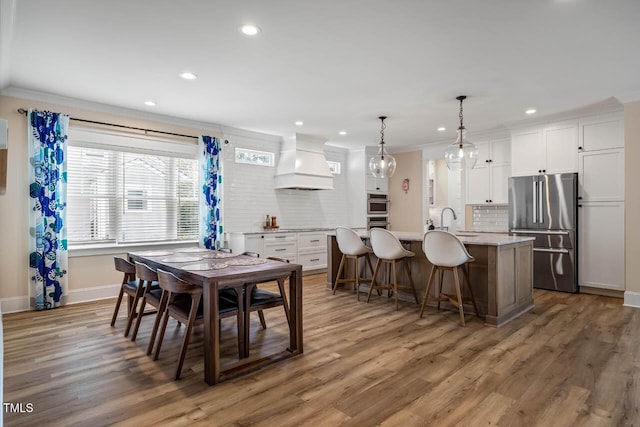 309 N Mason St, Apex, NC 27502 - dining space with ornamental molding, recessed lighting, and light wood finished floors