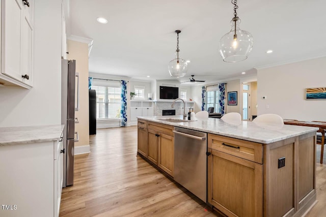 309 N Mason St, Apex, NC 27502 - kitchen with dishwasher, open floor plan, a ceiling fan, ornamental molding, and hanging light fixtures