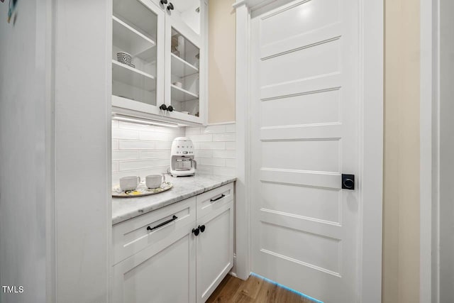 309 N Mason St, Apex, NC 27502 - bar with decorative backsplash and dark wood-style floors