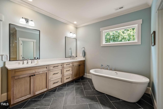 309 N Mason St, Apex, NC 27502 - full bathroom featuring ornamental molding, a freestanding tub, double vanity, and tile patterned flooring