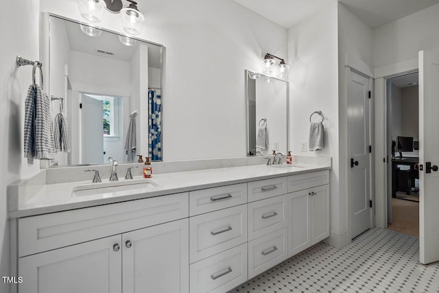 309 N Mason St, Apex, NC 27502 - bathroom featuring double vanity and tile patterned floors