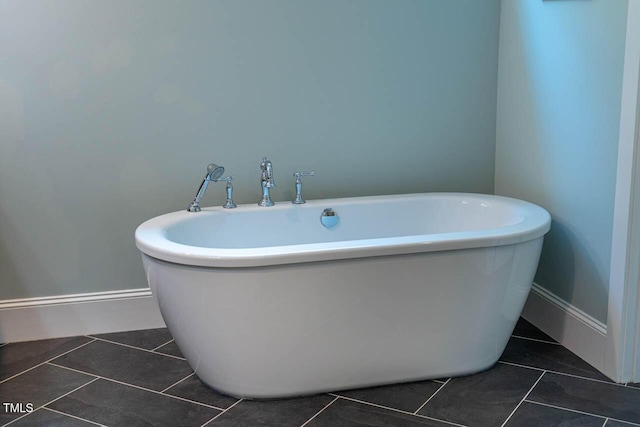 309 N Mason St, Apex, NC 27502 - bathroom with a freestanding bath and tile patterned floors