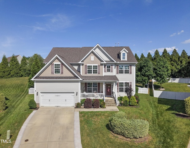 90 E Calvert Ct, Clayton, NC 27527 - view of front of house featuring a porch, driveway, an attached garage, and a shingled roof