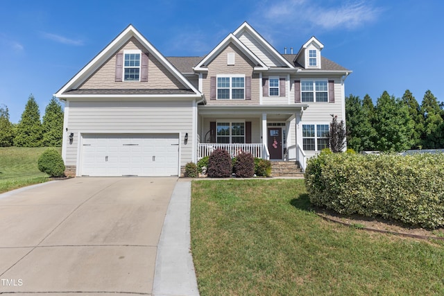 90 E Calvert Ct, Clayton, NC 27527 - view of front facade featuring a porch, driveway, a front lawn, and an attached garage