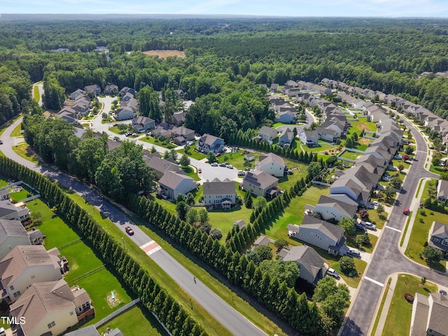 90 E Calvert Ct, Clayton, NC 27527 - aerial perspective of suburban area with a heavily wooded area