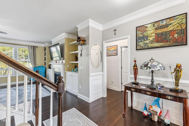 90 E Calvert Ct, Clayton, NC 27527 - foyer entrance with wood finished floors, stairs, crown molding, and a fireplace
